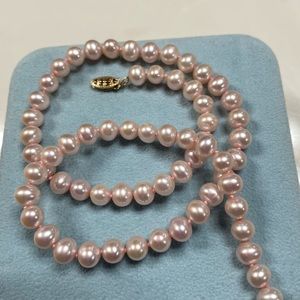 Lovely High-luster genuine pearl necklace with 14k gold fish hook closure.